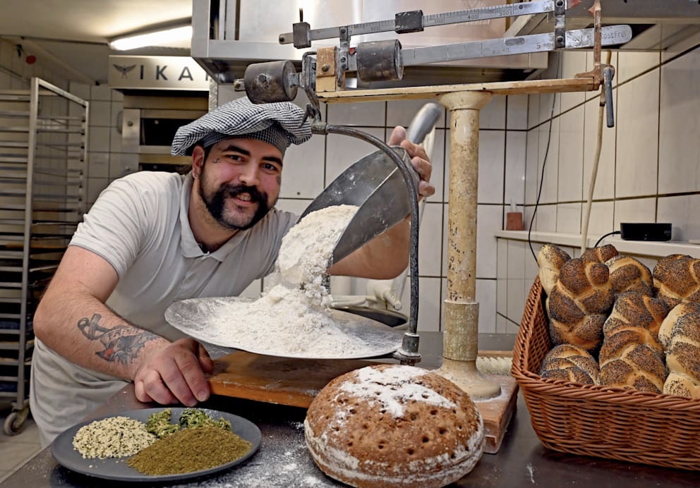 Master baker Pascal weighing the ingredients for his hemp baked goods